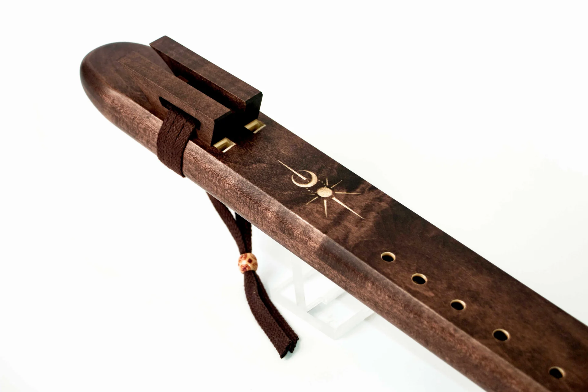 Double chamber drone flute key of A showing maple wood grain